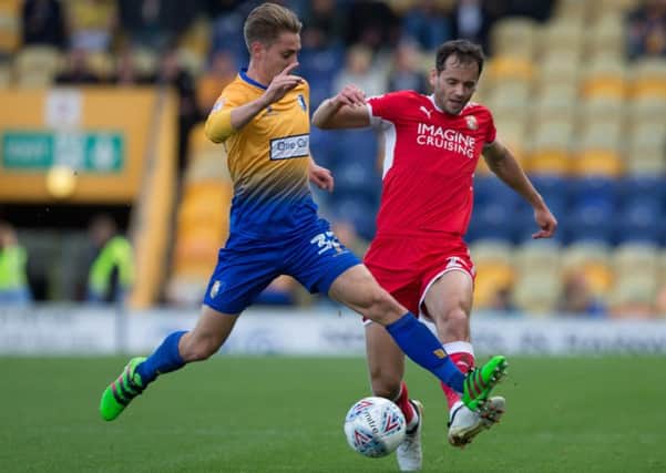 Mansfield Town vs Swindon Town - Danny Rose of Mansfield Town battles with Ben Purkiss of Swindon Town - Pic By James Williamson