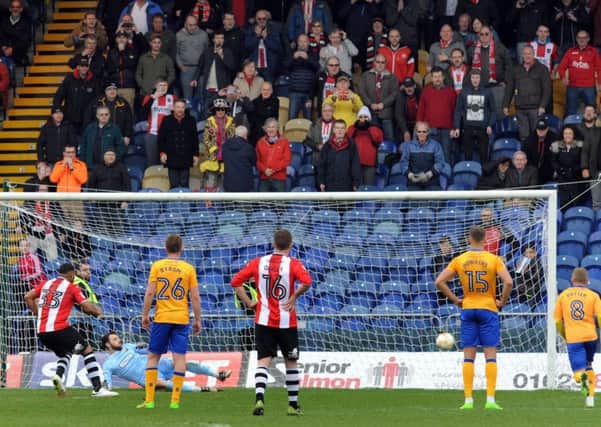 Mansfield Town v Exeter.
Exeter's Reuben Reid scores their last minute penalty to take all three points last season