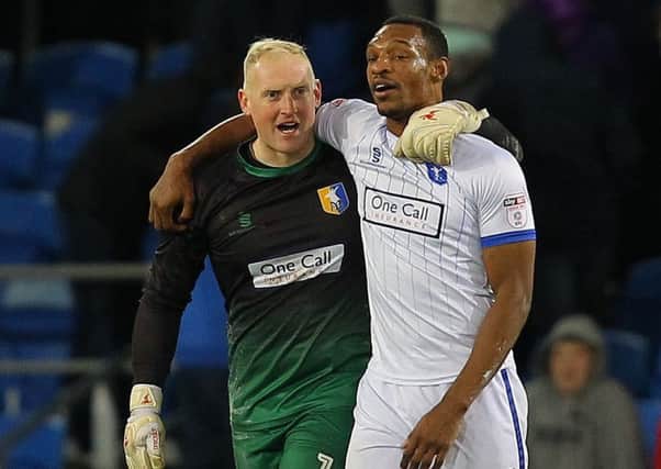 Picture by Gareth Williams/AHPIX.com; Football; The Emirates FA Cup; Cardiff City v Mansfield Town; 6/1/18  KO 15.00; Cardif City Stadium; copyright picture; Howard Roe/AHPIX.com; Mansfield skipper Krystian Pearce celebrates with goalkeeper Conrad Logan who was their injury-time hero with a fantastic save to ensure a replay