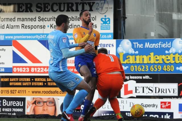 Mansfield Town v Coventry
CJ Hamilton is second to the ball.