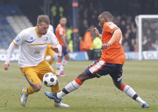 Louis Briscoe skips past Luton's Lathaniel Rowe-Turner -Pic by:Richard Parkes