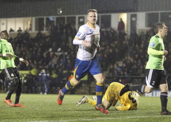 Lee Stevenson wheels away after scoring Stags' second goal of the night -Pic by:Richard Parkes