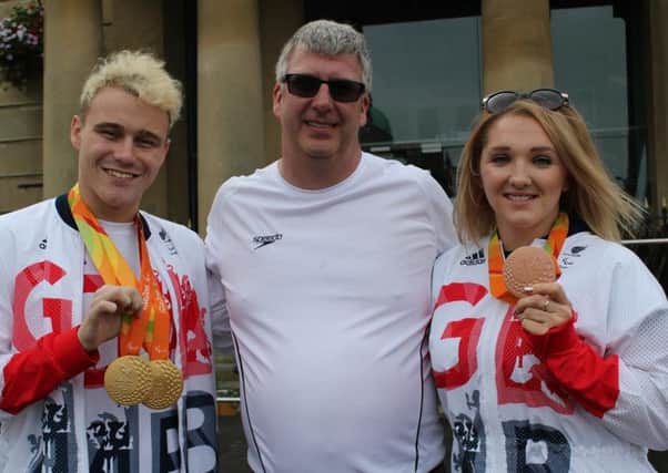 Ollie Hynd with coach Glenn Smith and Charlotte Henshaw