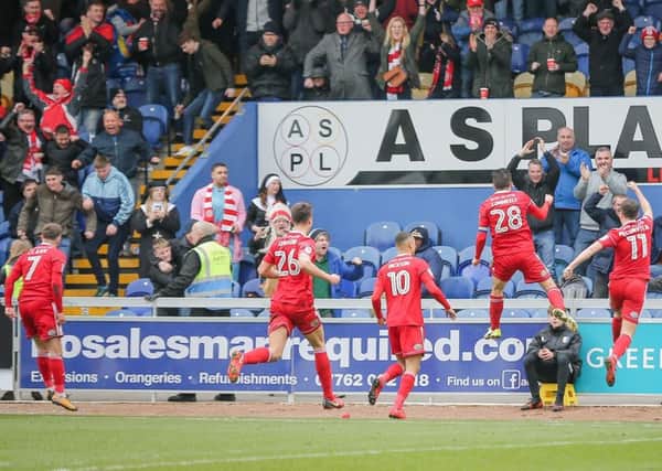 Accrington Stanley celebrate their goal with their travelling fans