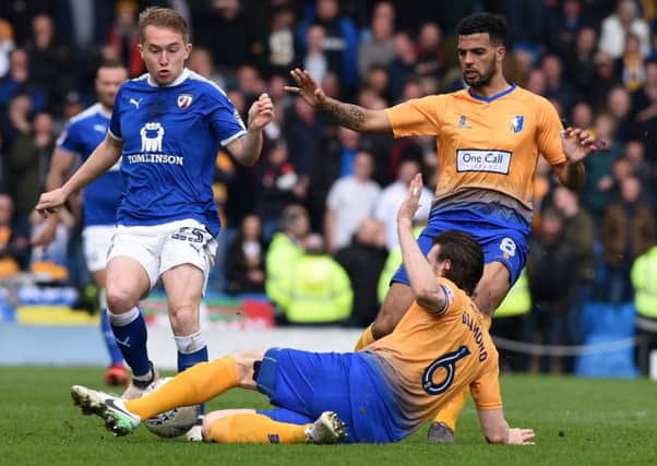 Picture Andrew Roe/AHPIX LTD, Football, EFL Sky Bet League Two, Chesterfield v Mansfield Town, Proact Stadium, 14/04/18, K.O 1pm

Chesterfield's Louis Reed is tackled by Mansfield's Zander Diamond

Andrew Roe>>>>>>>07826527594