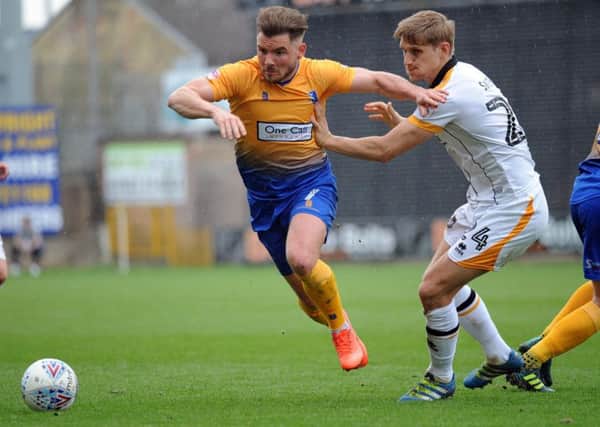 Mansfield Town v Port Vale.   
Alex MacDonald in second half action.