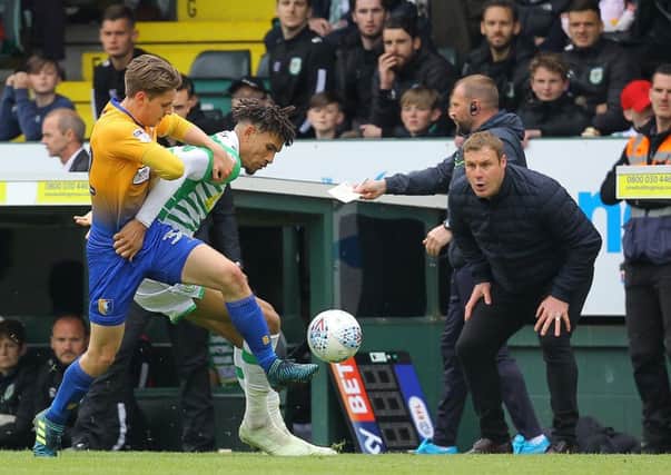 Picture by Gareth Williams/AHPIX.com; Football; Sky Bet League Two; Yeovil Town v Mansfield Town; 28/4/18  KO 15:00; Huish Park; copyright picture; Howard Roe/AHPIX.com; Stags' Danny Rose battles with Yeovil's Omar Sowunmi as David Flitcroft urges him on