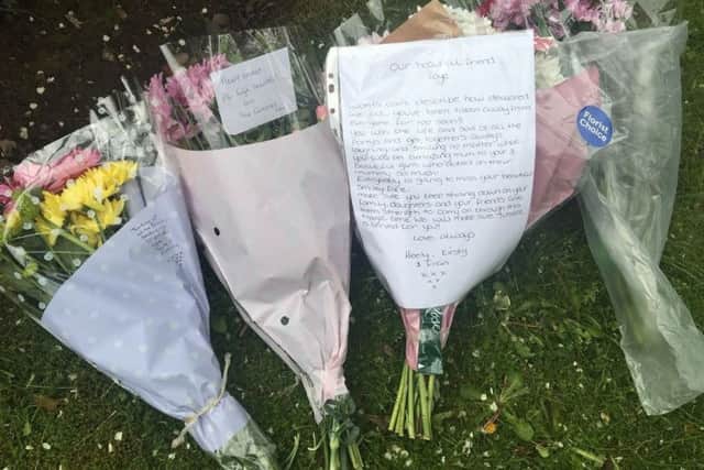 Tributes left at the scene of the tragedy describe the woman as "the life and soul of the party" and "always laughing and smiling no matter what".
