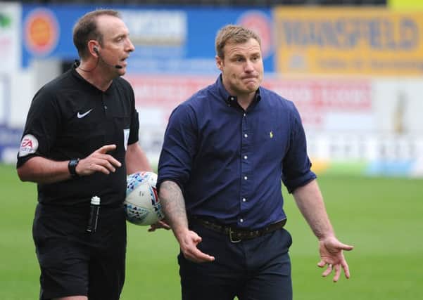 Mansfield Town v Port Vale.     
David Flitcroft with the referee after Saturday's game against Port Vale.