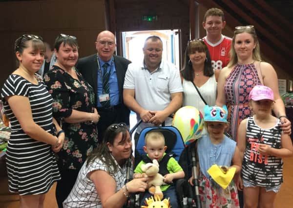 Mason in his pushchair at the fun day alongside mum Lisa and with dad Mark, Hucknall councillor John Wilmott and other supporters.